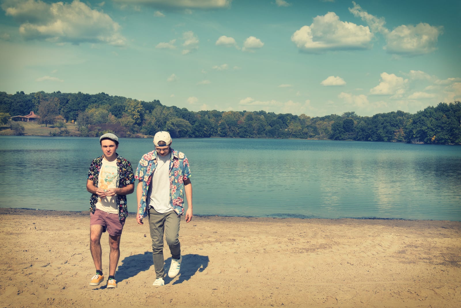 Stephen Michael and Jake Long walking along a sandy lakeshore