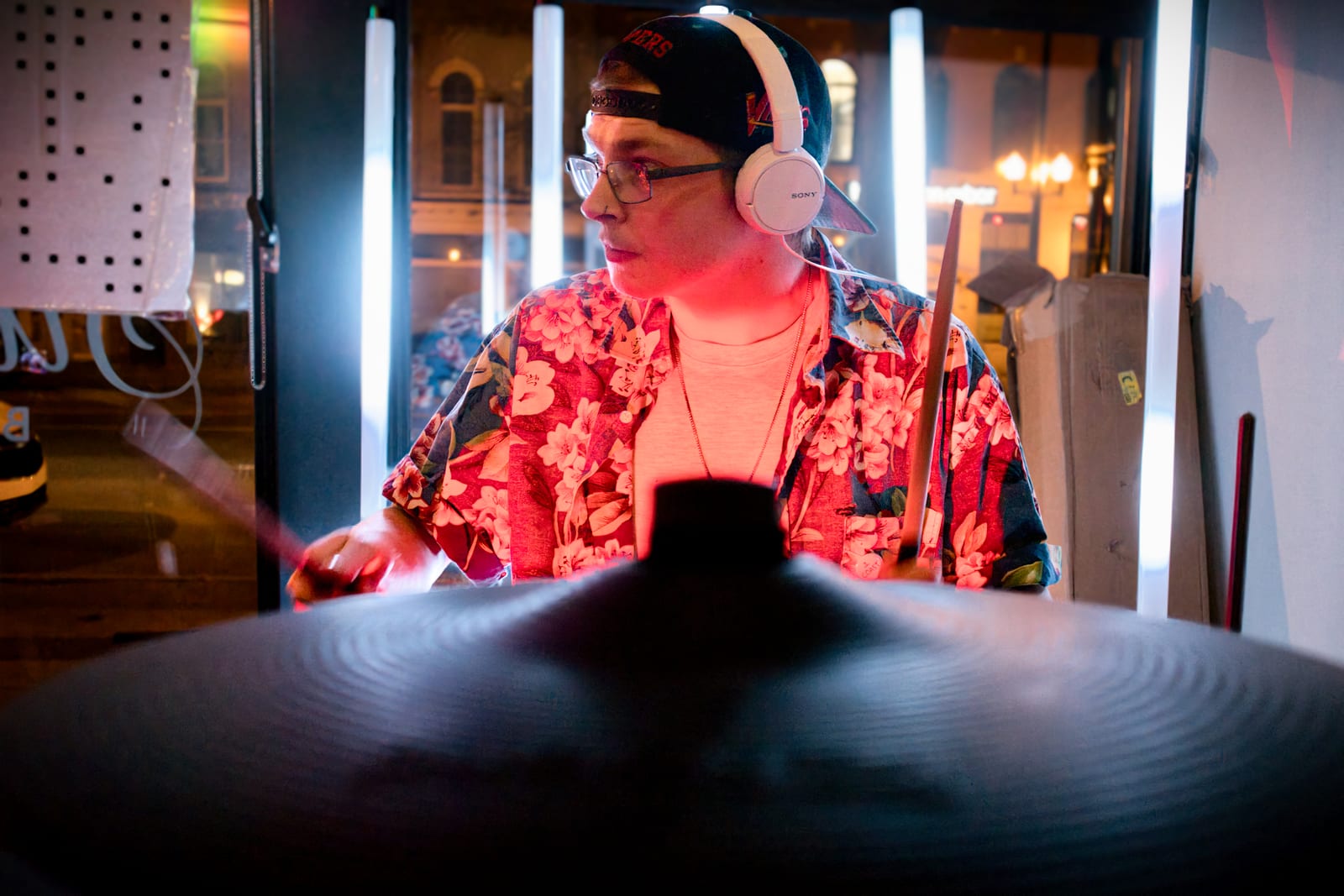 Jake Long performing behind a cymbal and percussion setup